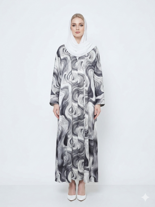 Fair-skinned model with grey eyes wearing the Rizqé Bianco Swirl satin kimono abaya with a matching white inner dress and scarf against a solid white studio background.